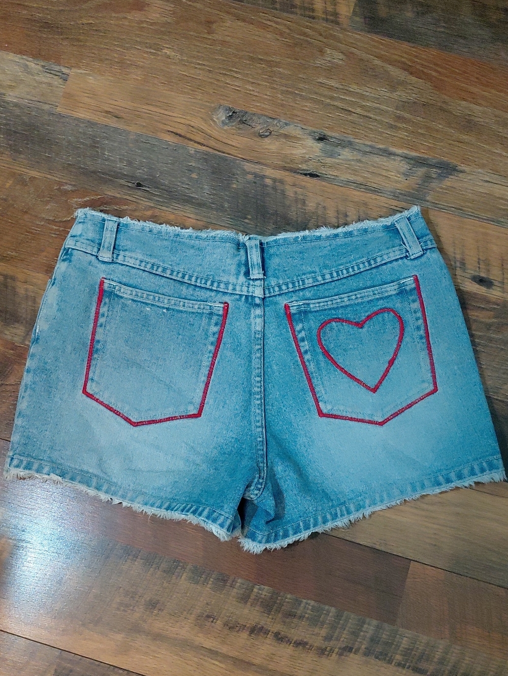 Light Blue Denim Shorts with Red Heart Stitch Detail & Frayed Waist. 7